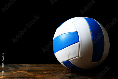 Volleyball ball on black background