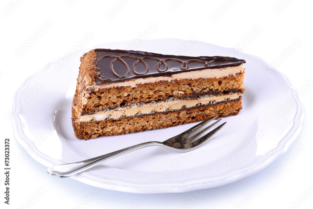 Delicious chocolate cake on plate isolated on white Delicious chocolate cake on plate isolated on white