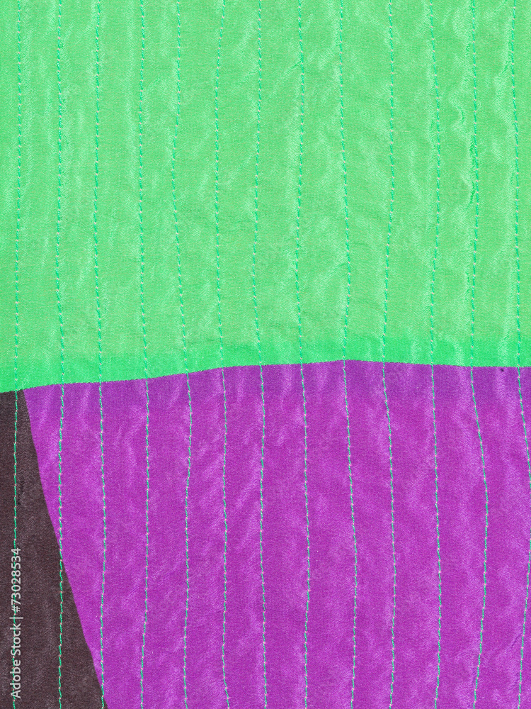 patchwork textile background from stitched silk