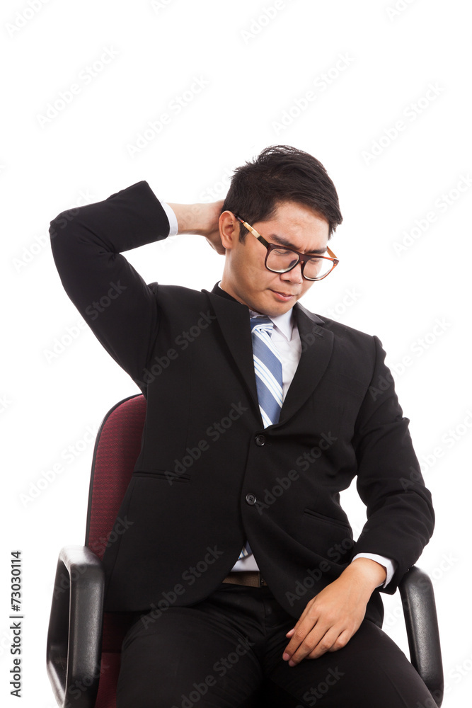 Asian businessman sit on office chair with neck pain Asian businessman sit on office chair with neck pain