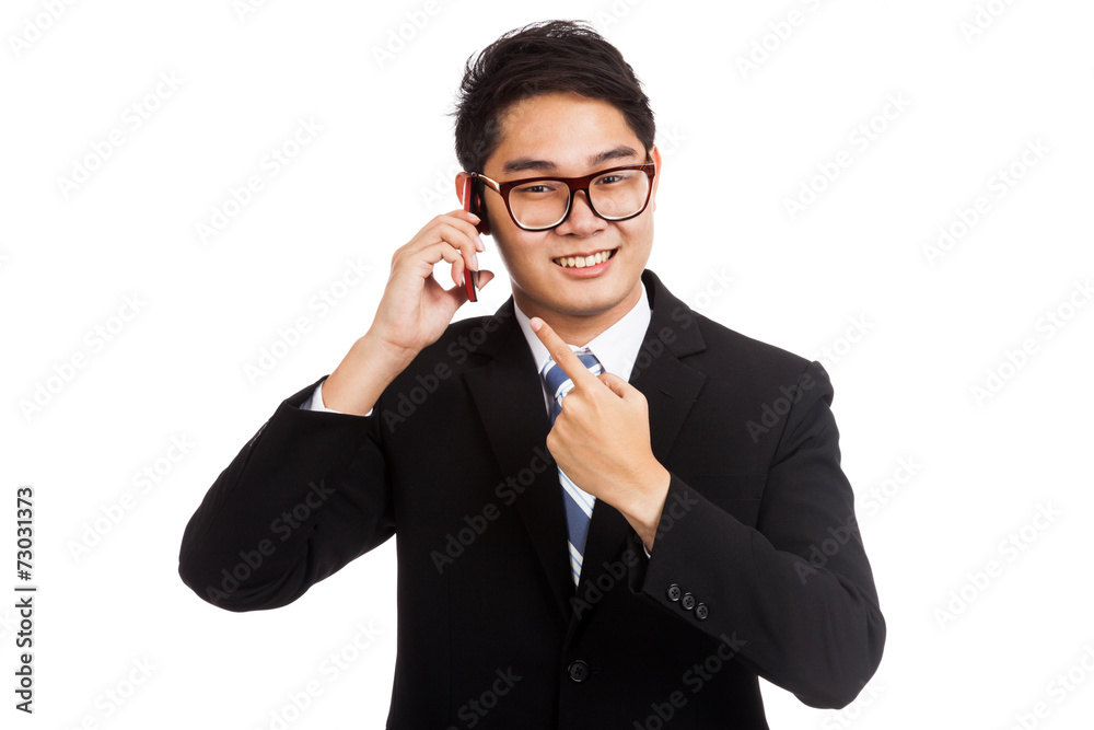 Asian businessman smile talk and point to mobile phone Asian businessman smile talk and point to mobile phone