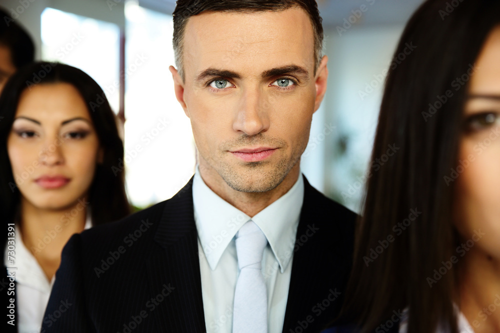 Group of a young businesspeople standing in a row Group of a young businesspeople standing in a row