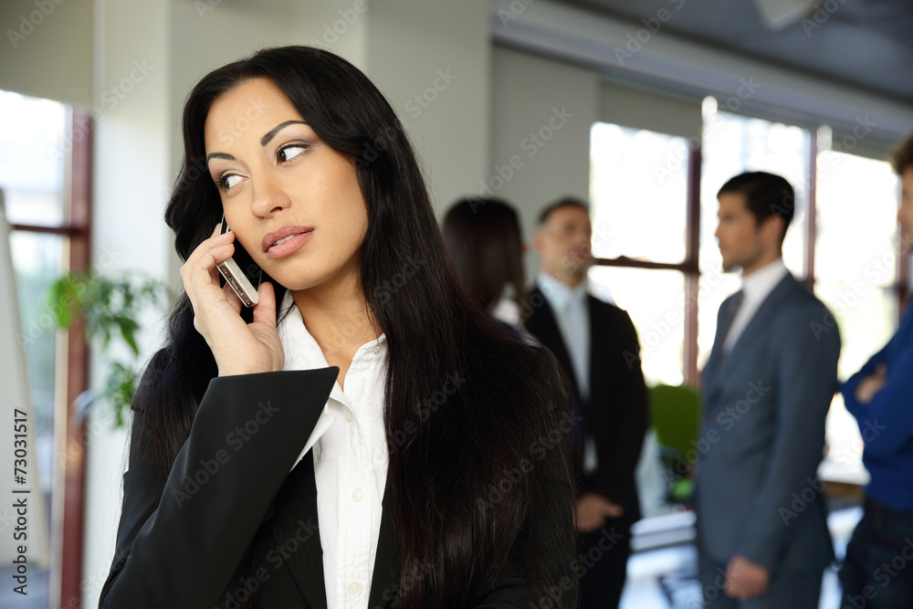 Beautiful businesswoman talking on the phone Beautiful businesswoman talking on the phone