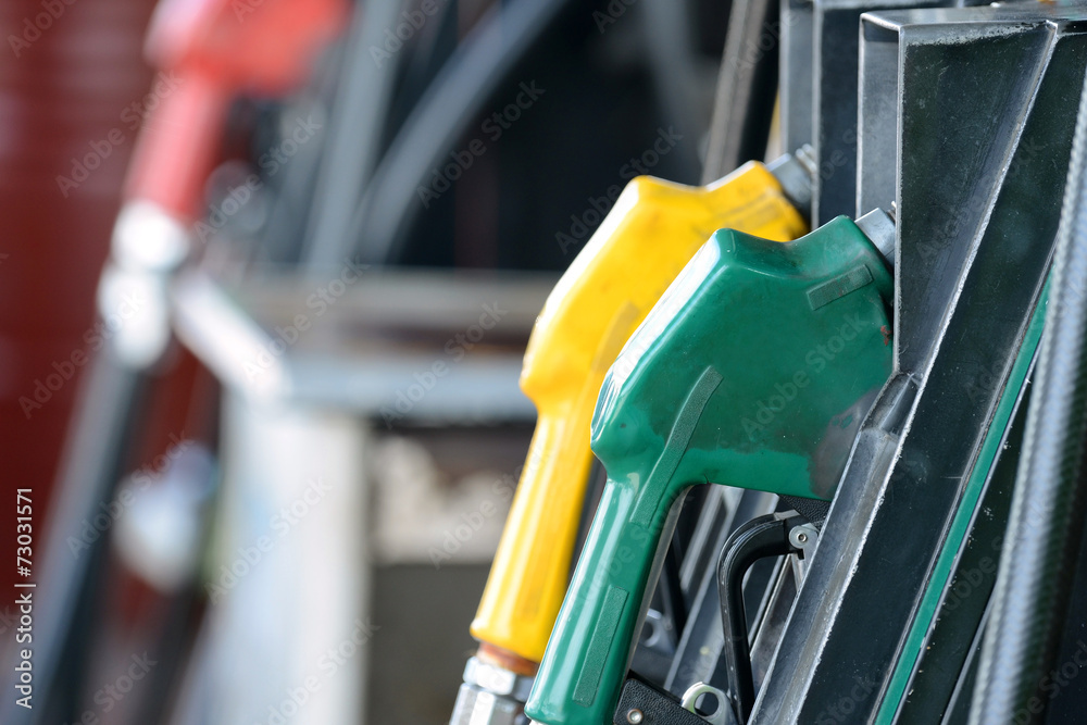 Petrol gas station pump and pumping gasoline fuel Petrol gas station pump and pumping gasoline fuel