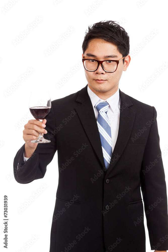 Asian businessman with glass of red wine Asian businessman with glass of red wine