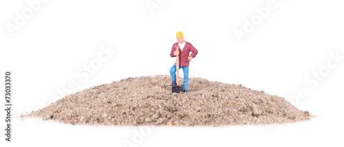 Miniature worker with a shovel