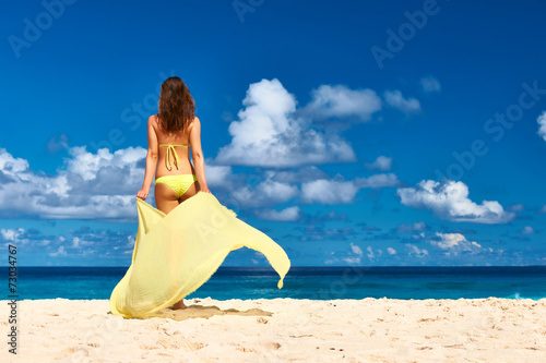Fotografie Woman with sarong at beach