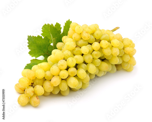 Ripe grapes with leaves close up on white background