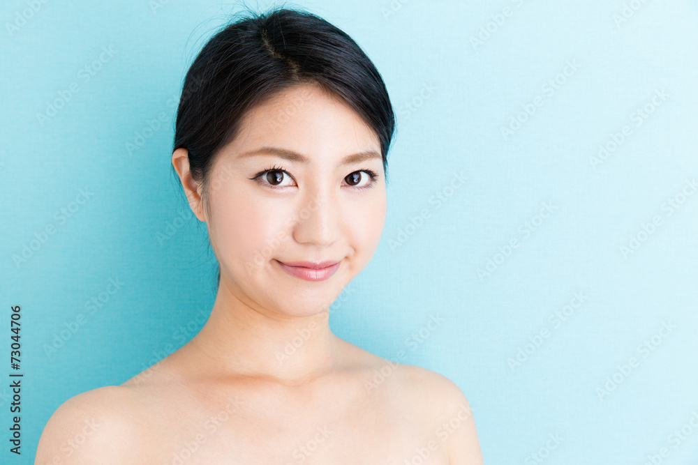 attractive asian woman beauty image on blue background attractive asian woman beauty image on blue background