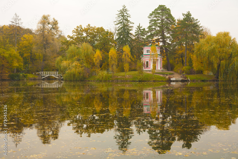 Ancient pink pavilion on autumn park lake Ancient pink pavilion on autumn park lake