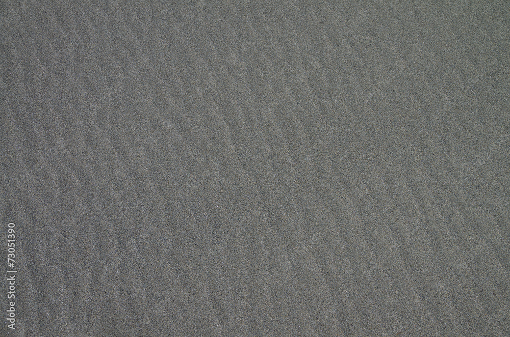 Fototapeta premium Gray sandy surface as background.