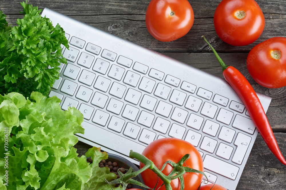 Keyboard and vegetables. Online recipe search.