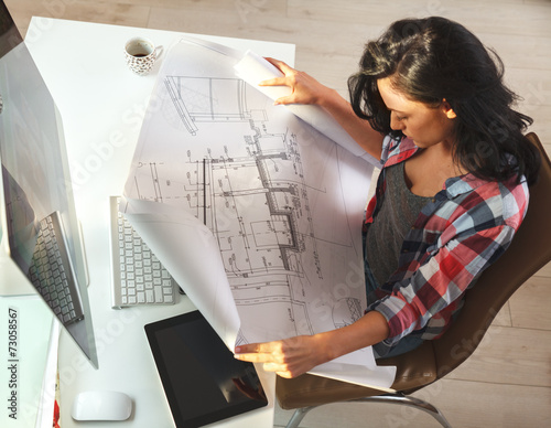 Female architect working at home. photo