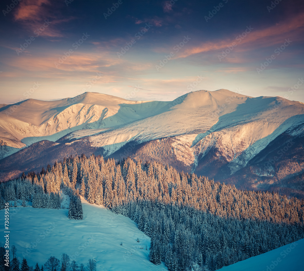 Colorful winter sunrise in mountains.