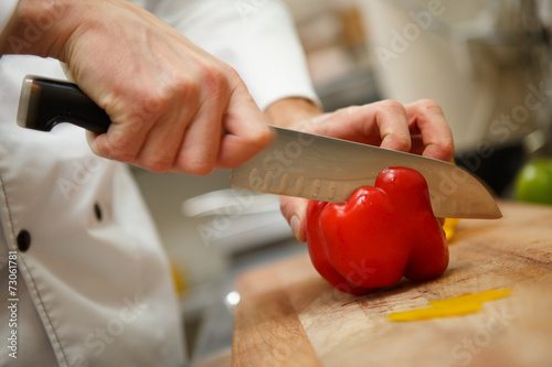 man's hands cutting pepper. Salad preparation