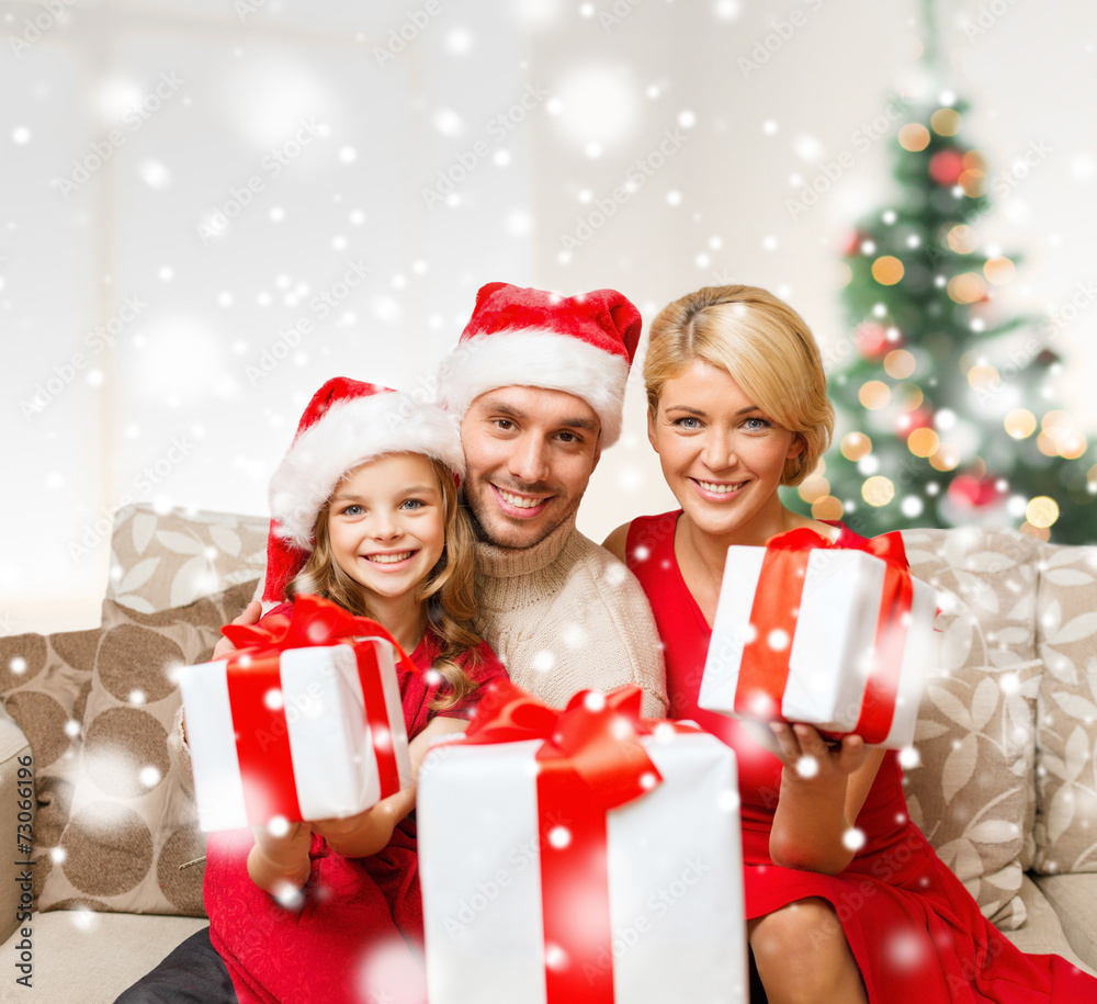 smiling family holding many gift boxes smiling family holding many gift boxes