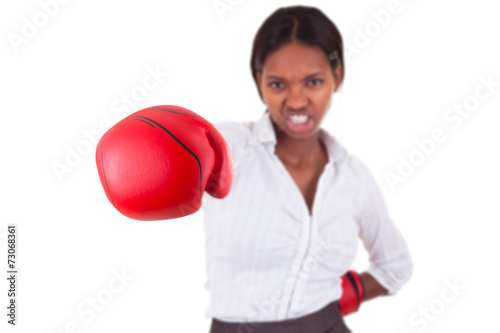Young black woman wearing boxing gloves © Samuel B.