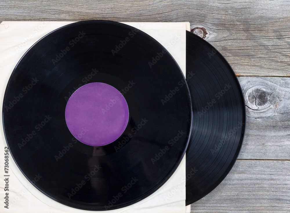 Obraz premium Stack of old music records on aged wood