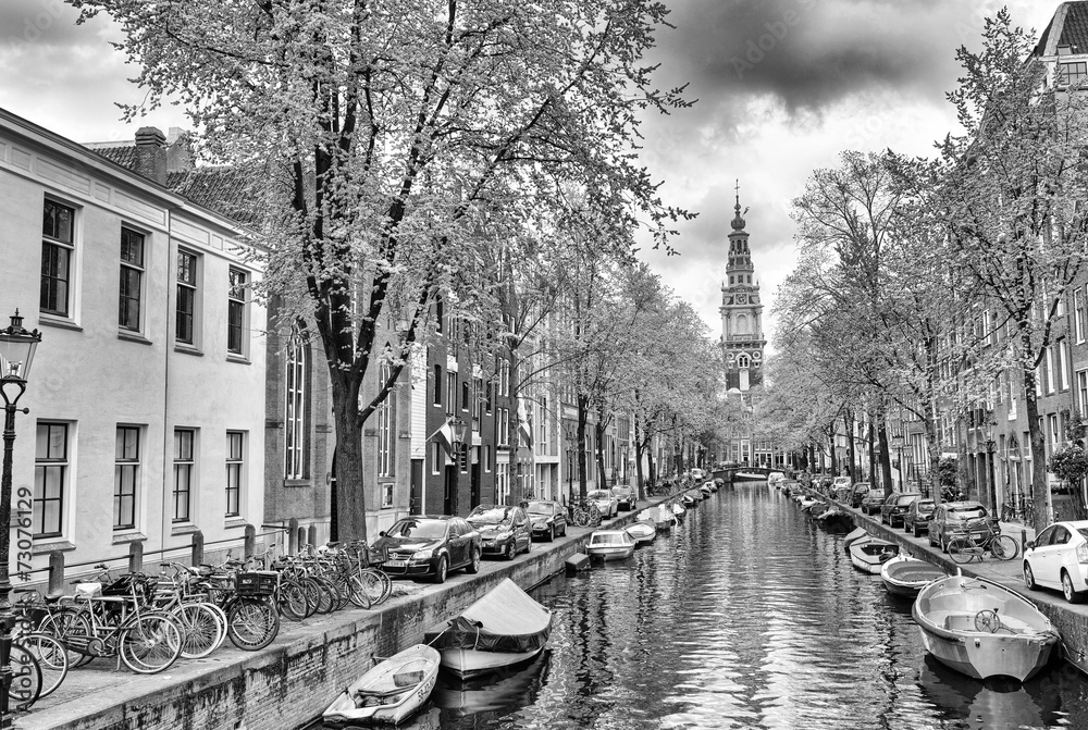 Fototapeta premium Amsterdam. Wonderful view of city canals and buildings in spring