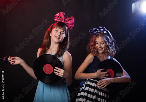 teenage girls having fun and dancing at a party