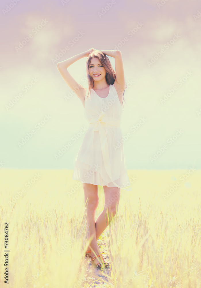 Portrait of beautiful young woman in field Portrait of beautiful young woman in field