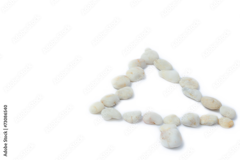 white pebbles on a white background in the form of spruce white pebbles on a white background in the form of spruce