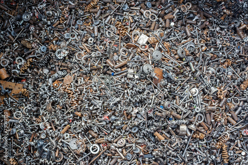 ferrous scrap and mechanisms of various sizes seen from above.