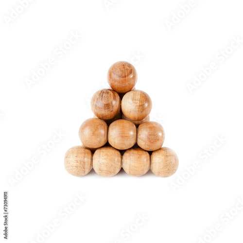 Triangle of wooden balls isolated over white