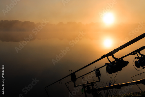 Carp fishing rods misty lake France
