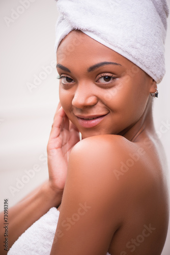 Beautiful dark skinned girl in white towel