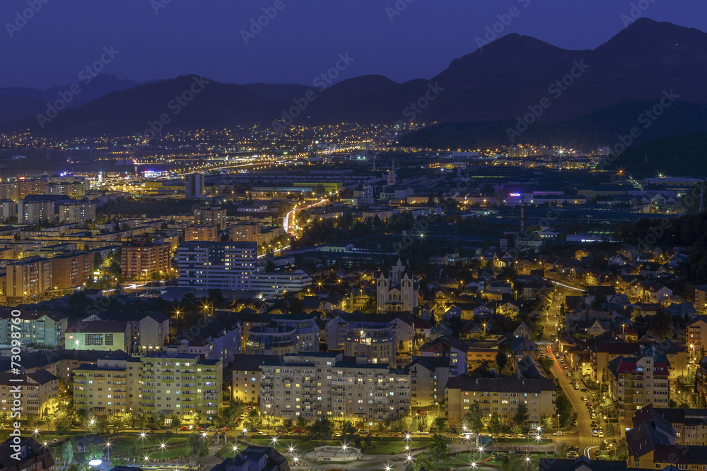 Aerial night cityscape of Brasov city, Romania