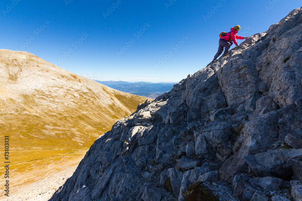 Woman climbong mountain slope