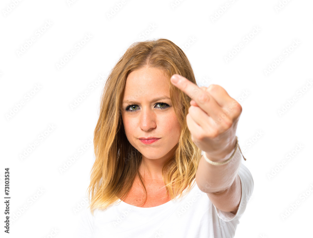Girl making horn gesture over white background Girl making horn gesture over white background