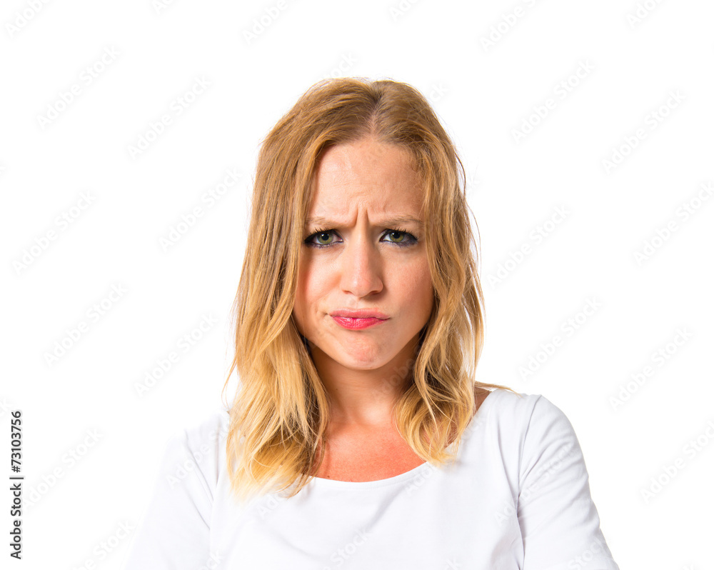 Girl with her arms crossed over white background Girl with her arms crossed over white background