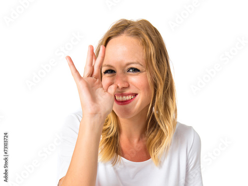 Girl making a joke over white background