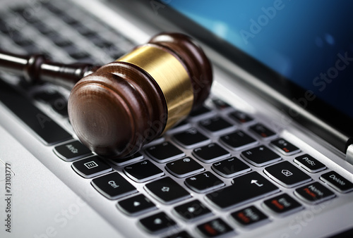 Justice gavel and laptop computer keyboard