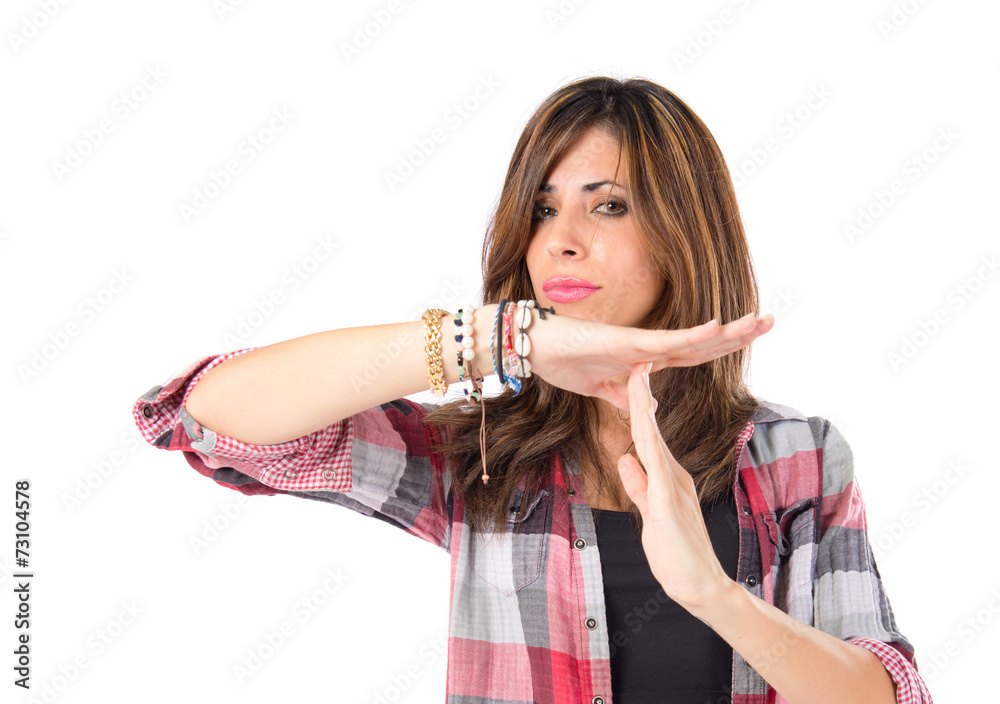 Girl making time out gesture over white background