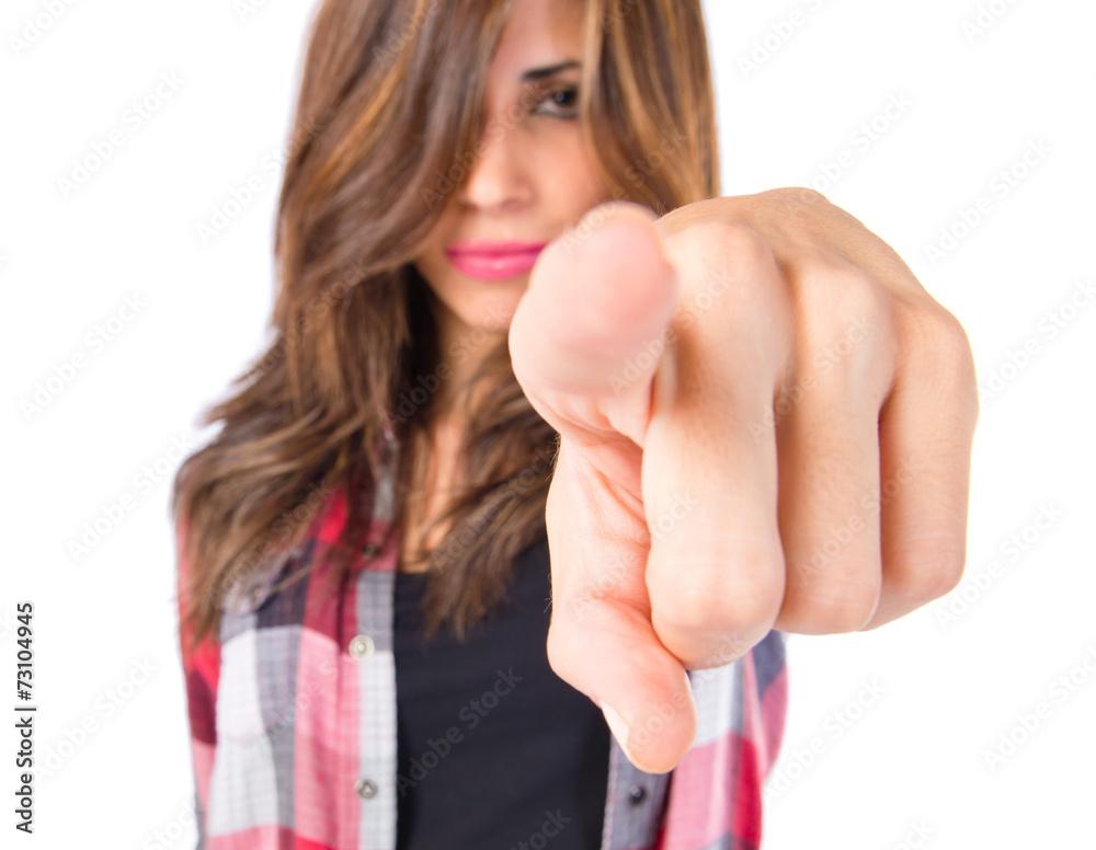 Girl pointing to the front over white background Girl pointing to the front over white background