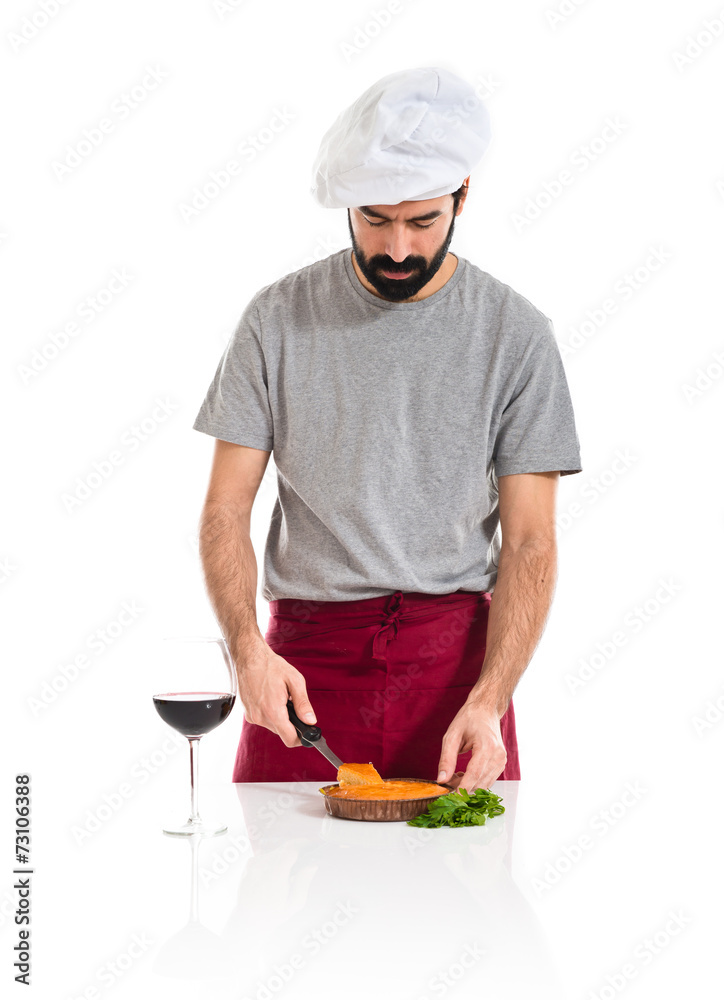 Chef cutting a cake