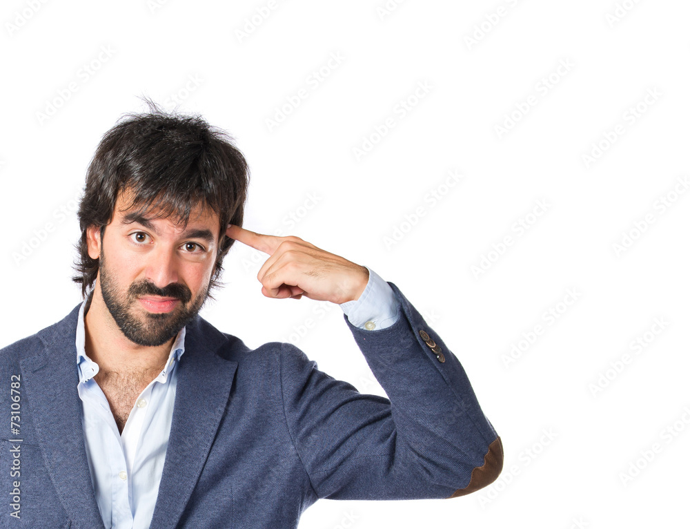 Man making suicide gesture over white background Man making suicide gesture over white background