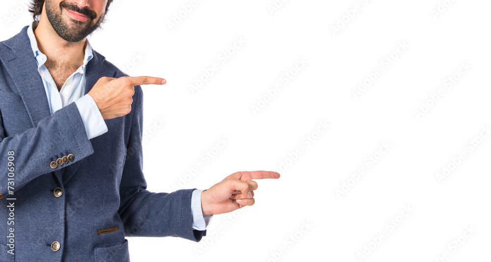 Man pointing to the front over white background Man pointing to the front over white background