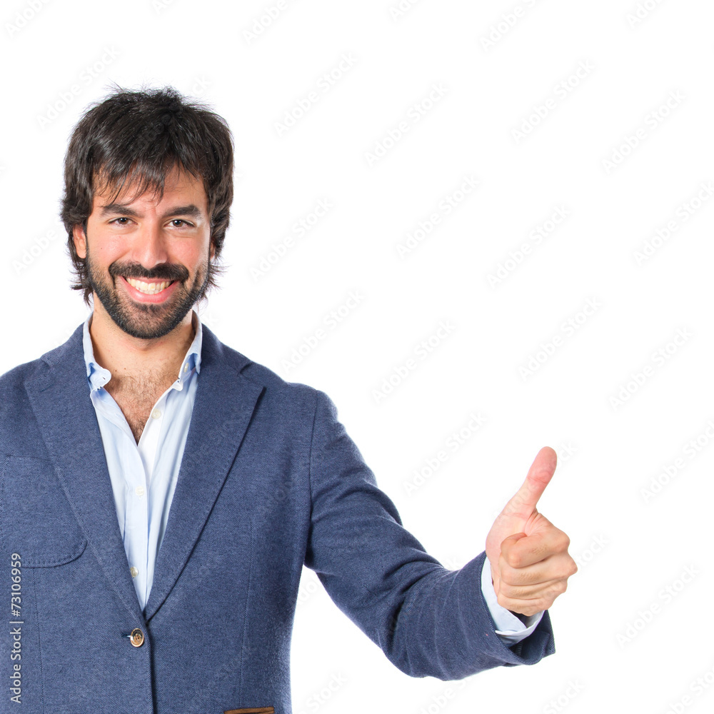 Handsome man with thumb up over white background Handsome man with thumb up over white background