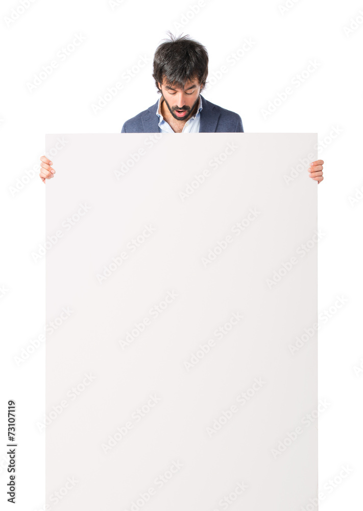 Businessman with empty placard over idolated white background Businessman with empty placard over idolated white background