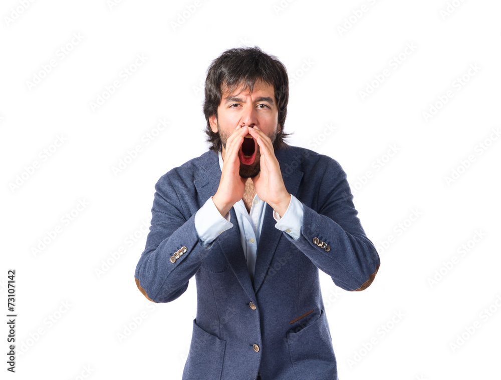 Handsome man shouting over isolated white background Handsome man shouting over isolated white background