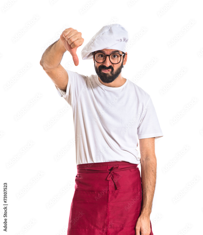 Chef doing a bad signal over white background Chef doing a bad signal over white background
