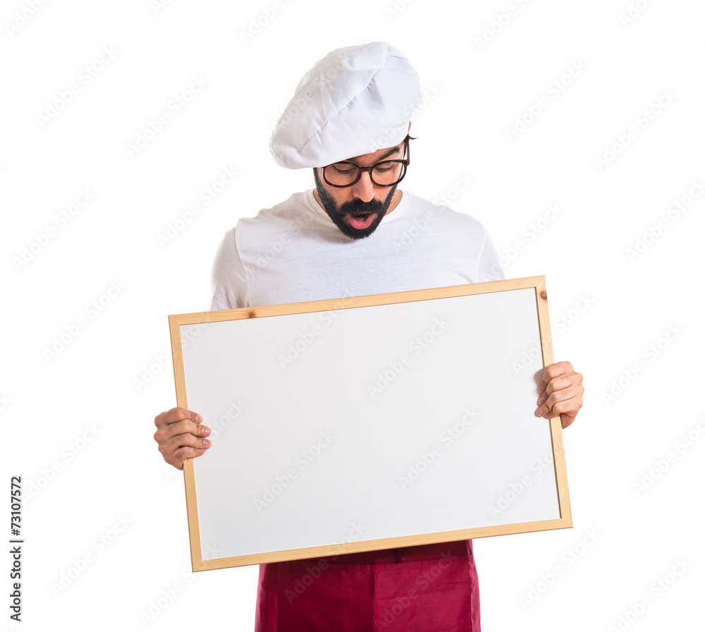 Surprised chef holding empty placard Surprised chef holding empty placard
