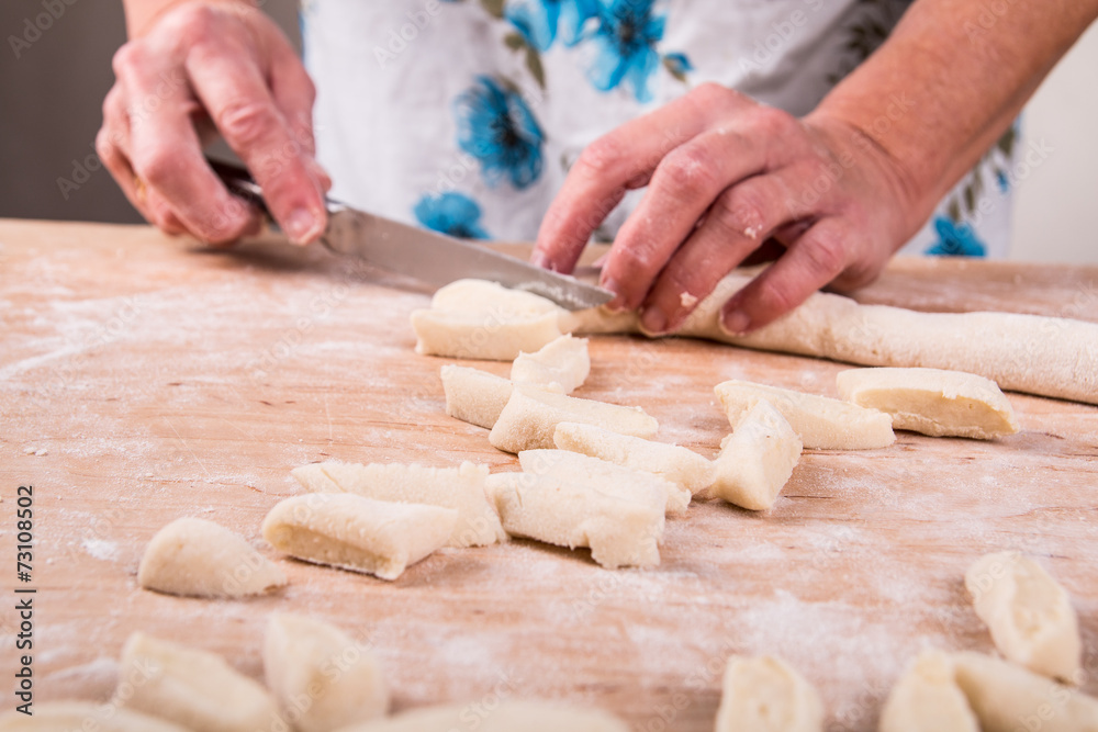 Making noodles on board from dough