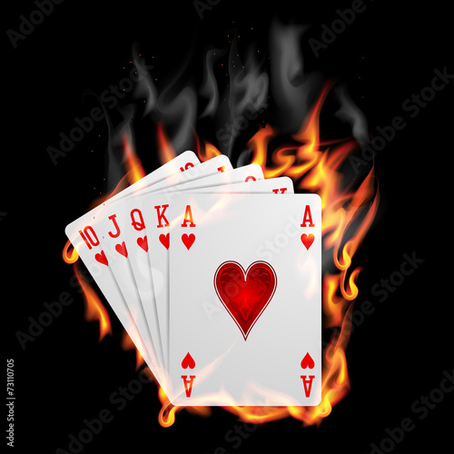 Poker cards burn in the fire.