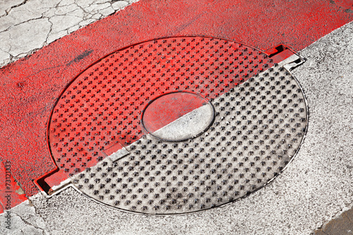 Closed round sewer manhole with stars pattern
