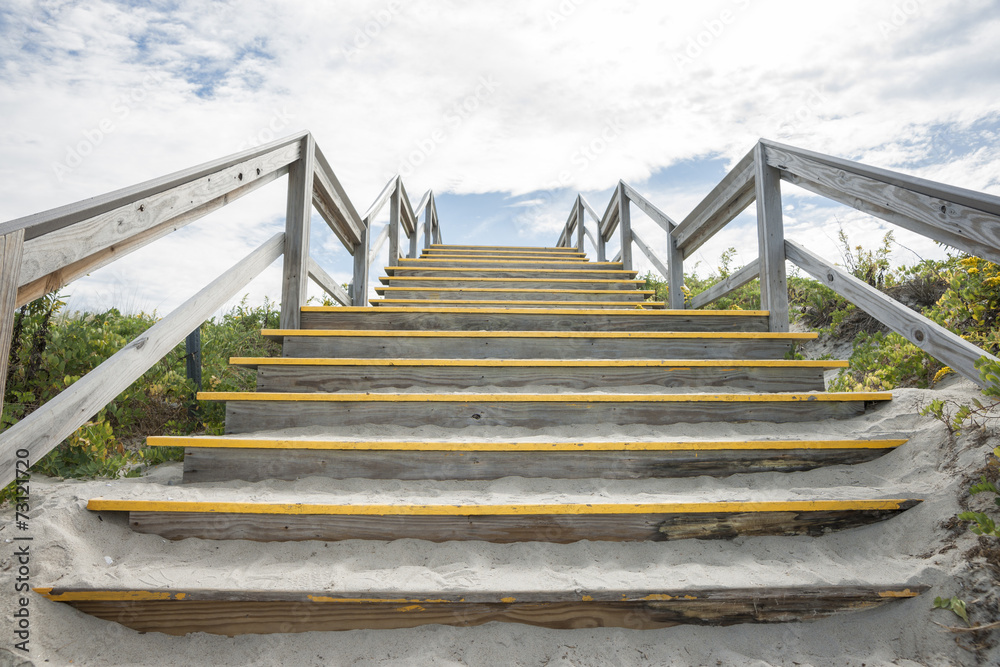 Fototapeta premium Steps over, protecting the dunes at Crane beach, MA USA